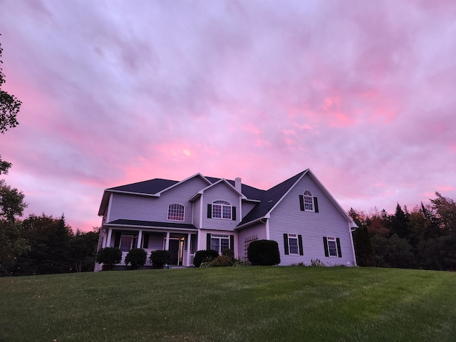275 Petit Rd, Coventry, VT 05825 - traditional home featuring a front yard, a porch, and a chimney