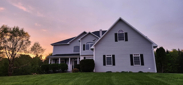 275 Petit Rd, Coventry, VT 05825 - traditional-style house featuring a chimney and a front lawn