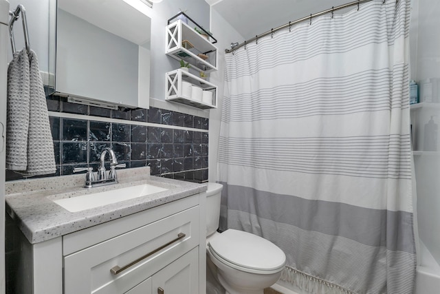 190 Anthony St, Manchester, NH 03103 - full bath with vanity, toilet, backsplash, and tile walls
