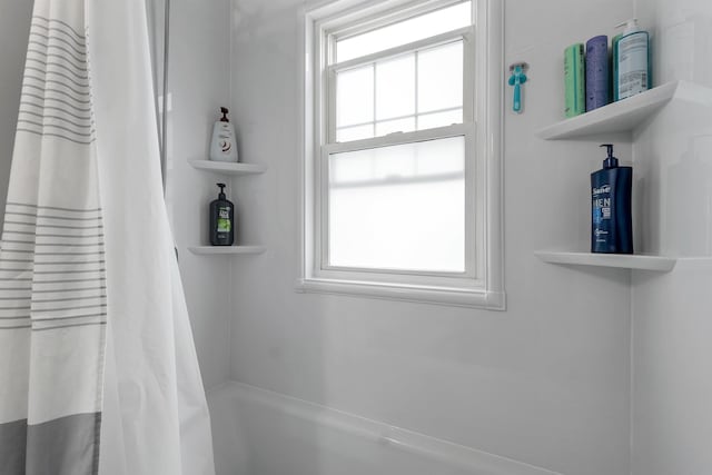 190 Anthony St, Manchester, NH 03103 - bathroom with healthy amount of natural light and shower / tub combo with curtain