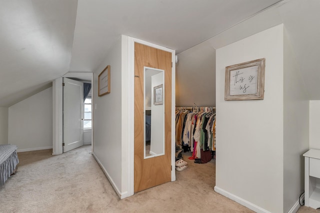 190 Anthony St, Manchester, NH 03103 - corridor featuring carpet floors, vaulted ceiling, and baseboards