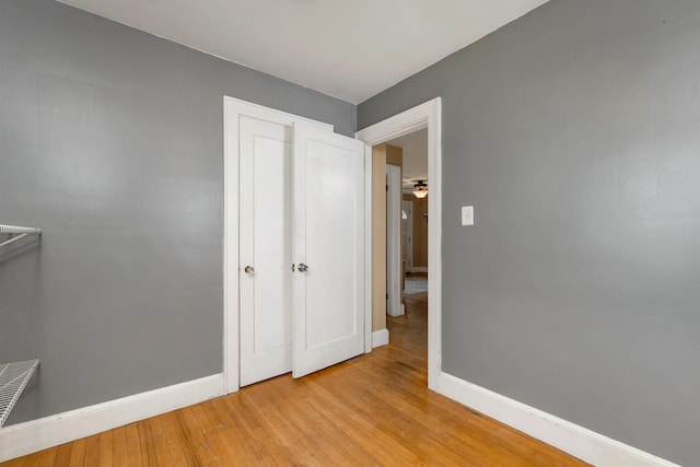 190 Anthony St, Manchester, NH 03103 - unfurnished bedroom featuring baseboards, light wood finished floors, and a closet