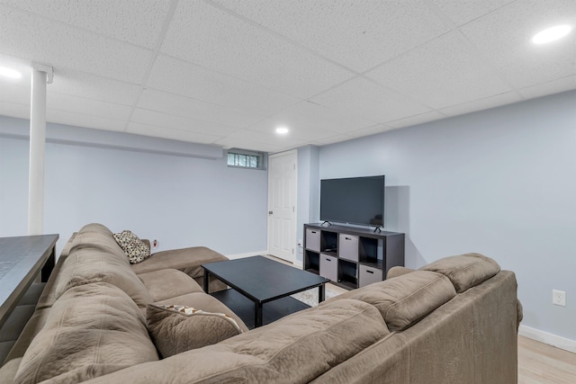 190 Anthony St, Manchester, NH 03103 - living area featuring light wood finished floors, baseboards, recessed lighting, and a paneled ceiling
