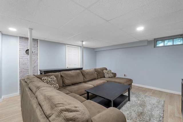 190 Anthony St, Manchester, NH 03103 - living room with light wood-type flooring, baseboards, and a drop ceiling