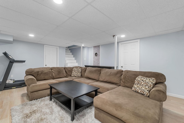 190 Anthony St, Manchester, NH 03103 - living area with wood finished floors, stairway, baseboards, and a paneled ceiling