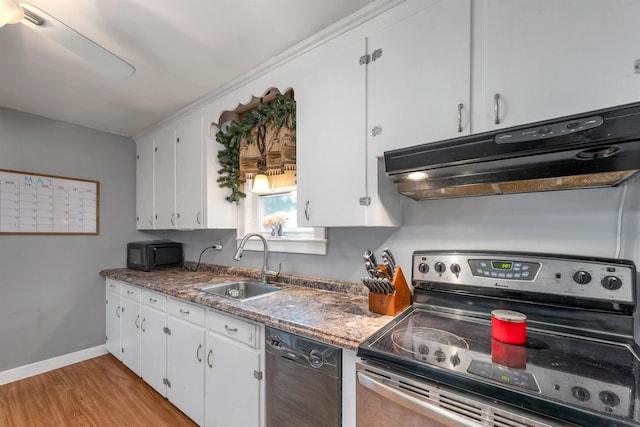 190 Anthony St, Manchester, NH 03103 - kitchen with black appliances, a sink, exhaust hood, white cabinetry, and light wood finished floors