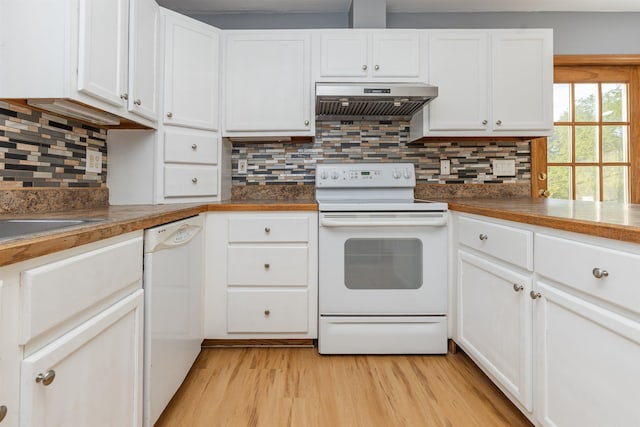 62 Indigo Hill Rd, Somersworth, NH 03878 - kitchen with white appliances, under cabinet range hood, light wood-type flooring, white cabinets, and backsplash