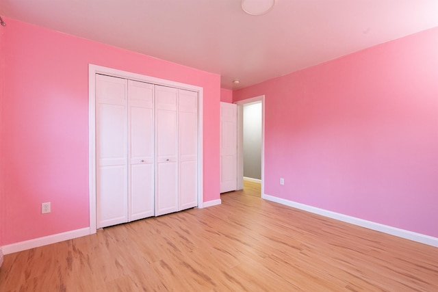 62 Indigo Hill Rd, Somersworth, NH 03878 - unfurnished bedroom featuring light wood-style floors, baseboards, and a closet
