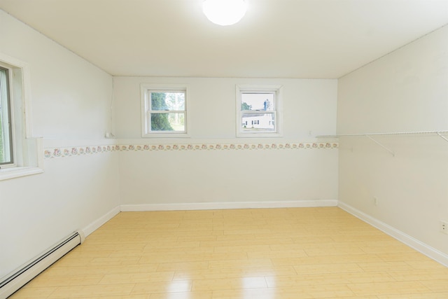 62 Indigo Hill Rd, Somersworth, NH 03878 - unfurnished room with a baseboard radiator and light wood-style flooring