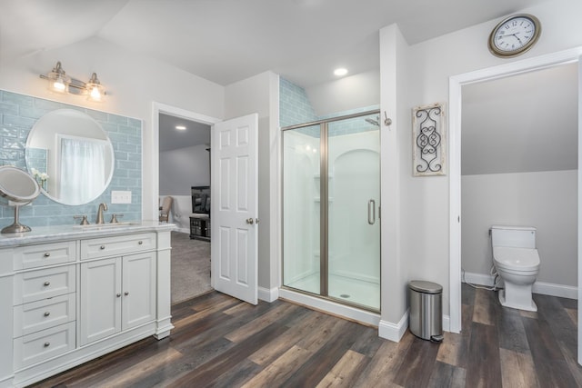 26 Association Dr, Northwood, NH 03261 - full bathroom with lofted ceiling, a stall shower, vanity, wood finished floors, and toilet
