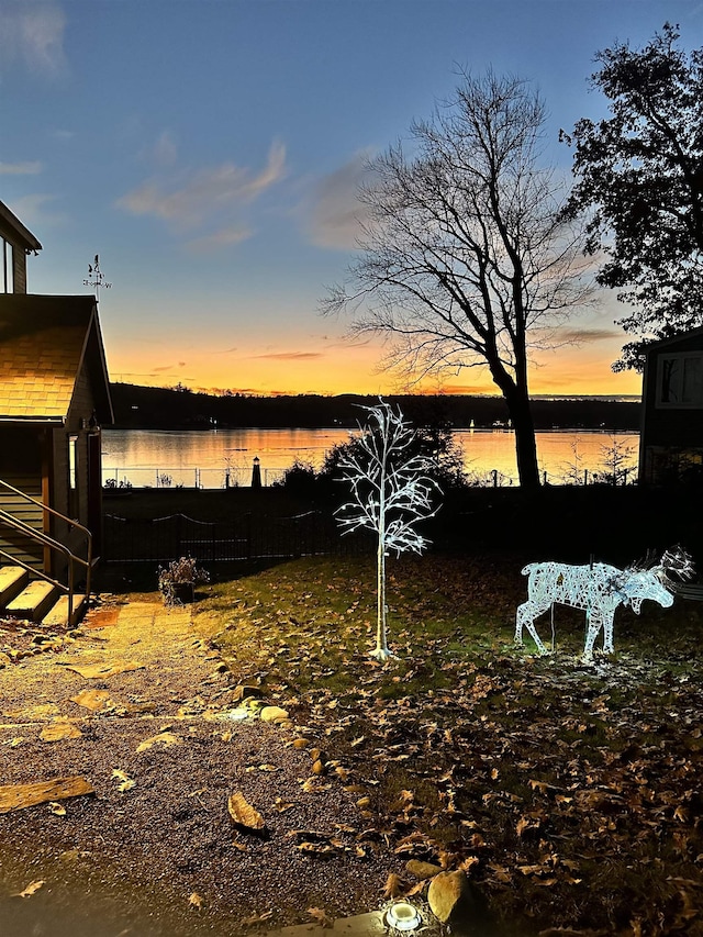 26 Association Dr, Northwood, NH 03261 - yard at dusk with a water view