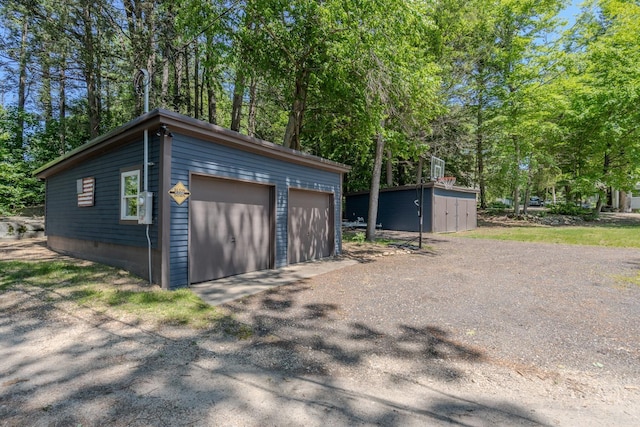 26 Association Dr, Northwood, NH 03261 - detached garage with view of wooded area