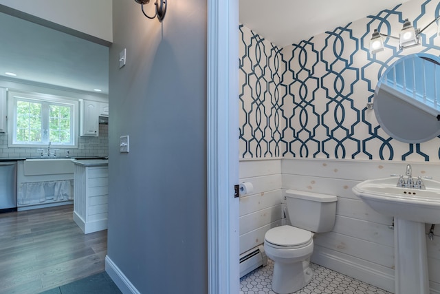 11 Rabbit Ln, Barrington, NH 03825 - bathroom featuring a baseboard radiator, a sink, toilet, and decorative backsplash