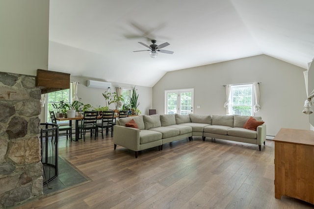 11 Rabbit Ln, Barrington, NH 03825 - living room featuring a ceiling fan, vaulted ceiling, an AC wall unit, hardwood / wood-style floors, and a baseboard radiator