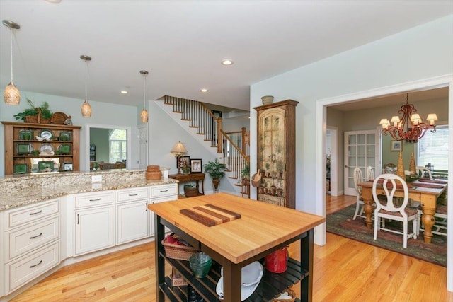 38 Granite Ln Unit 38, Chester, NH 03036 - kitchen featuring light wood-type flooring, a chandelier, plenty of natural light, decorative light fixtures, and recessed lighting