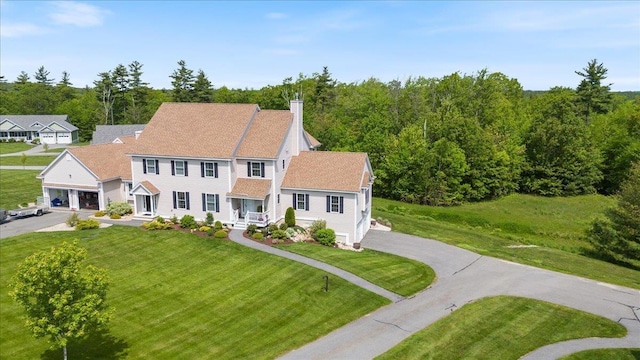 38 Granite Ln Unit 38, Chester, NH 03036 - view of front of home with asphalt driveway, a front lawn, and a chimney