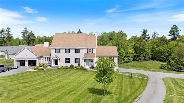 38 Granite Ln Unit 38, Chester, NH 03036 - colonial-style house featuring a chimney, a front yard, and asphalt driveway