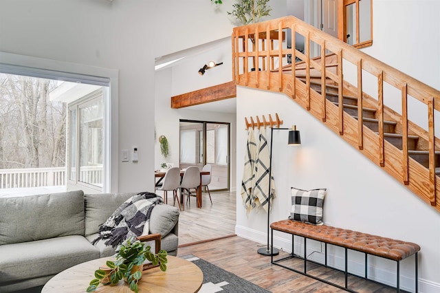 270 Beechnut Dr, Conway, NH 03860 - living area featuring stairway, wood finished floors, and baseboards