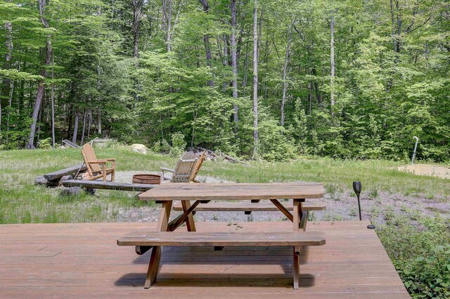 2554 Hurricane Mountain Rd, Conway, NH 03813 - wooden deck with a fire pit and a view of trees