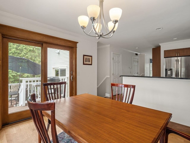 278 S Cove Rd, Burlington, VT 05401 - dining area featuring a chandelier, crown molding, and light wood-style floors