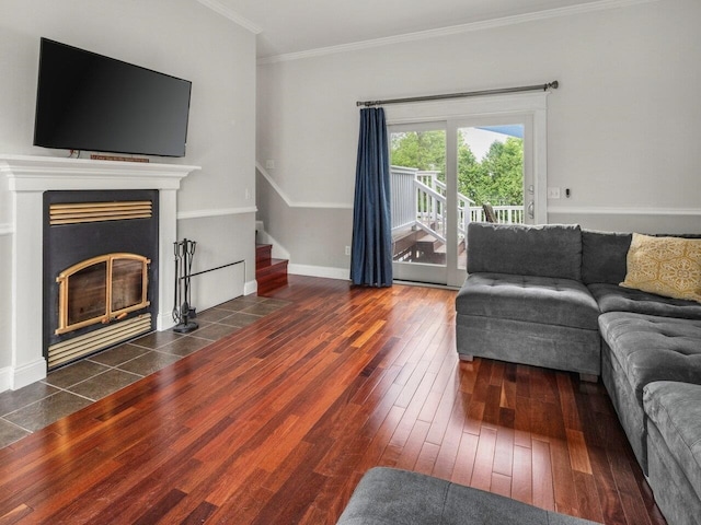 278 S Cove Rd, Burlington, VT 05401 - living area with wood finished floors, stairs, crown molding, a fireplace with flush hearth, and baseboards