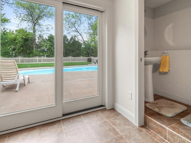 278 S Cove Rd, Burlington, VT 05401 - doorway to outside with light tile patterned floors and baseboards