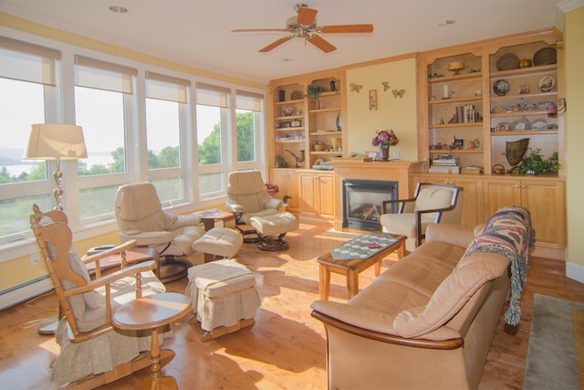 120 Pepin Dr Unit B 6, Newport City, VT 05855 - living room with built in features, ceiling fan, a glass covered fireplace, and light wood-style floors