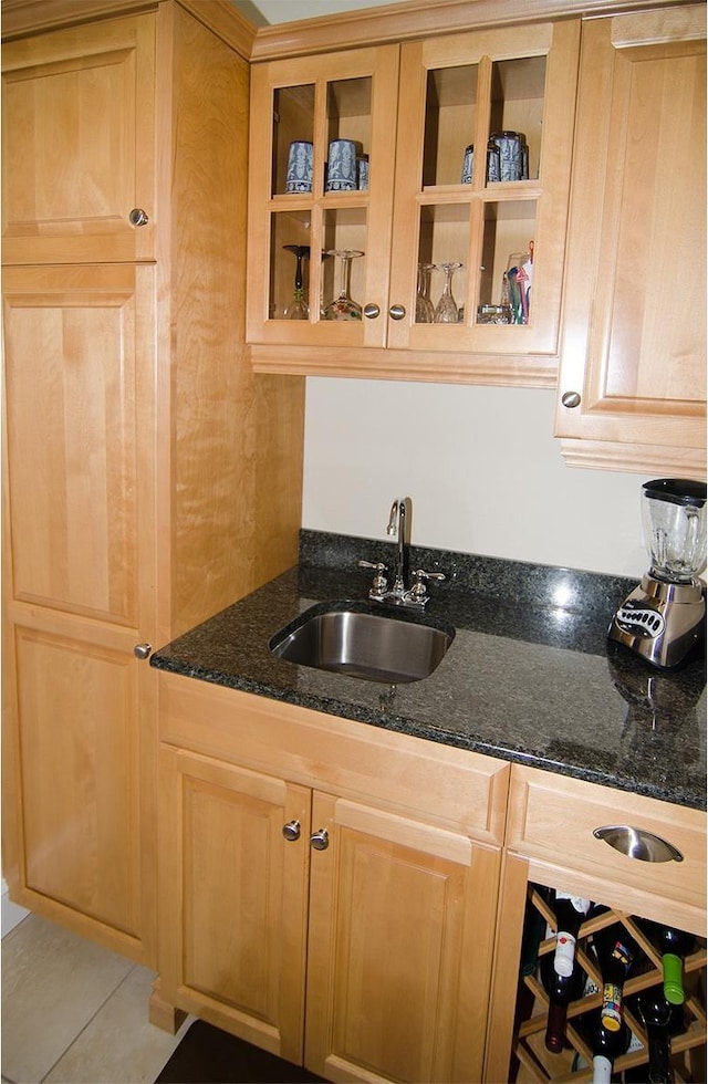 120 Pepin Dr Unit B 6, Newport City, VT 05855 - kitchen with a sink, glass insert cabinets, dark stone countertops, and tile patterned floors