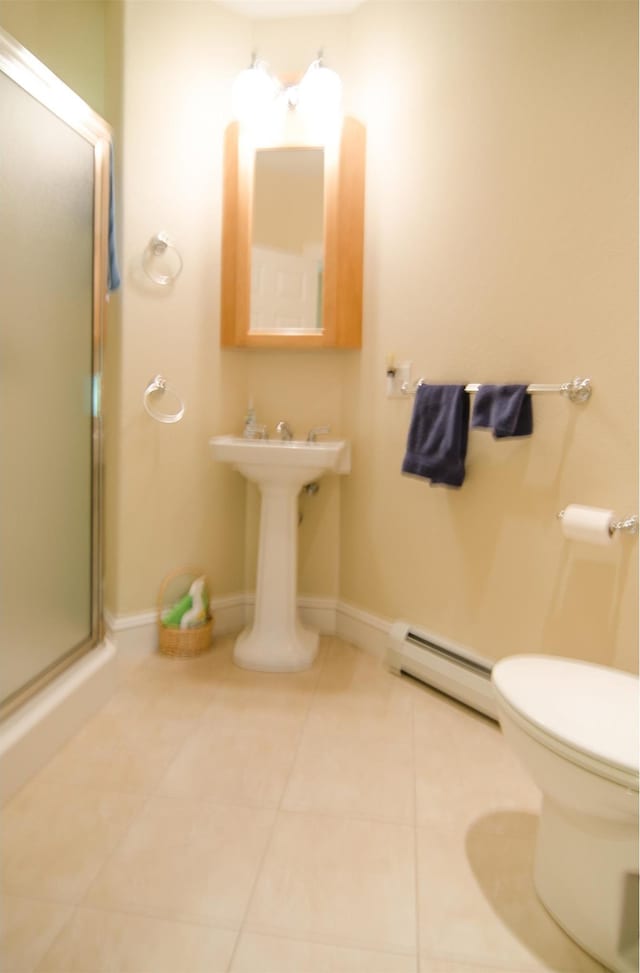 120 Pepin Dr Unit B 6, Newport City, VT 05855 - full bath featuring a baseboard heating unit, toilet, a stall shower, tile patterned flooring, and baseboards