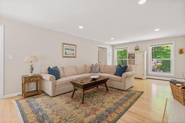 78 Hitching Post Ln, Bedford, NH 03110 - living room featuring healthy amount of natural light, light wood finished floors, recessed lighting, and a baseboard heating unit