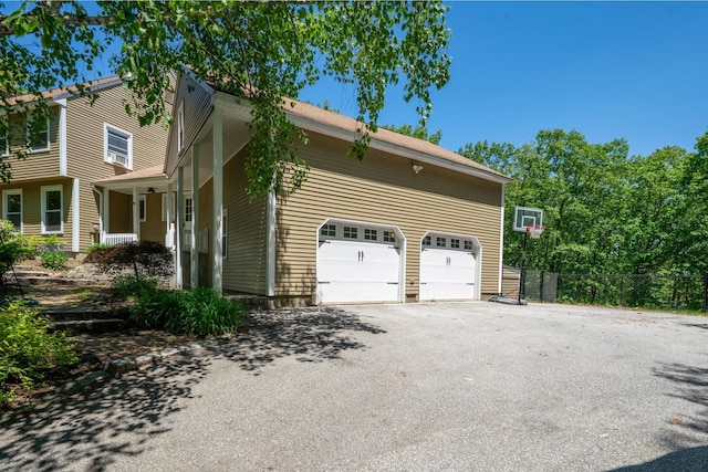 78 Hitching Post Ln, Bedford, NH 03110 - view of property exterior with driveway and a garage
