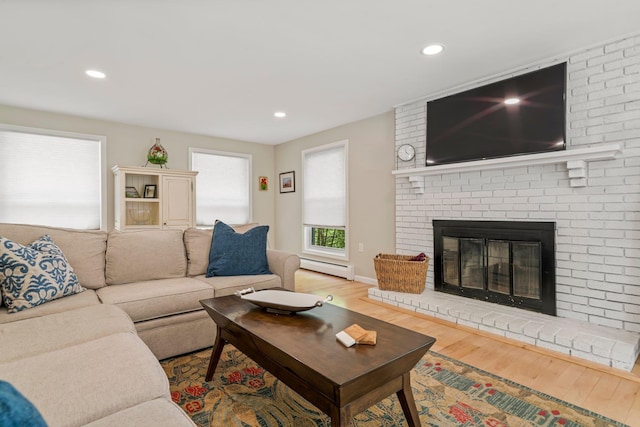 78 Hitching Post Ln, Bedford, NH 03110 - living area with a baseboard radiator, wood finished floors, recessed lighting, and a fireplace