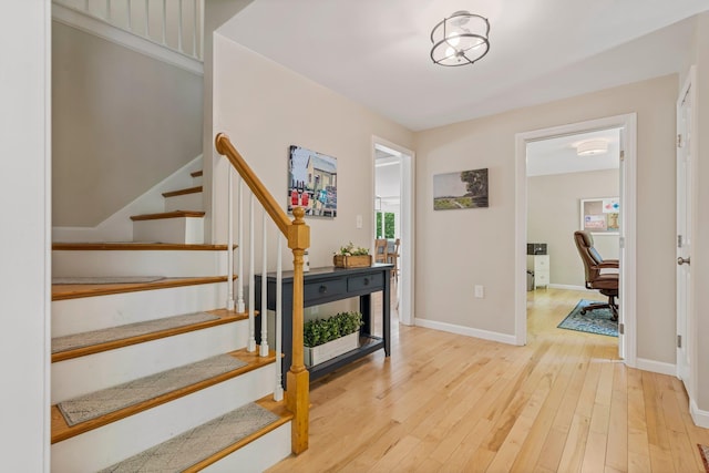 78 Hitching Post Ln, Bedford, NH 03110 - foyer entrance featuring wood finished floors, stairs, and baseboards