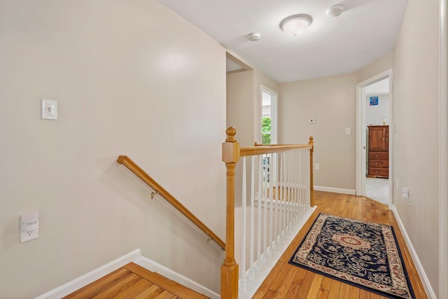 78 Hitching Post Ln, Bedford, NH 03110 - corridor featuring an upstairs landing, light wood finished floors, and baseboards