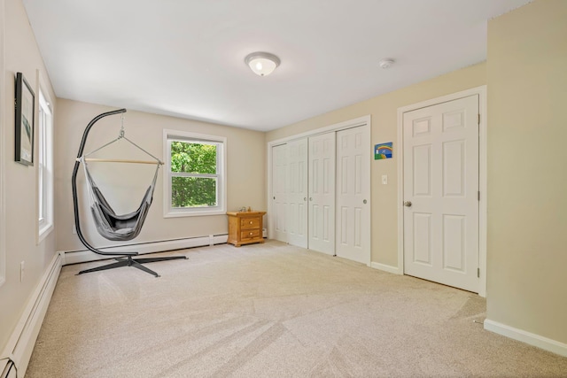 78 Hitching Post Ln, Bedford, NH 03110 - unfurnished bedroom featuring a baseboard heating unit, carpet, baseboards, and a closet
