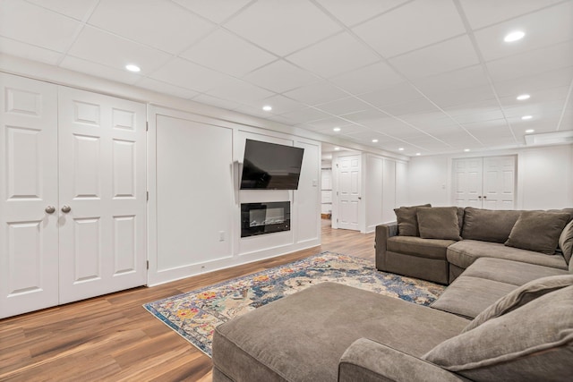 78 Hitching Post Ln, Bedford, NH 03110 - living area with wood finished floors, recessed lighting, and a paneled ceiling