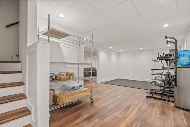 78 Hitching Post Ln, Bedford, NH 03110 - basement with wood finished floors, stairs, and recessed lighting