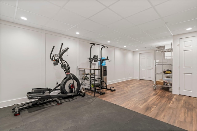 78 Hitching Post Ln, Bedford, NH 03110 - exercise room featuring wood finished floors, a paneled ceiling, and recessed lighting