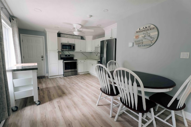 82 Garden Cir, Laconia, NH 03246 - dining area featuring a ceiling fan and light wood-type flooring