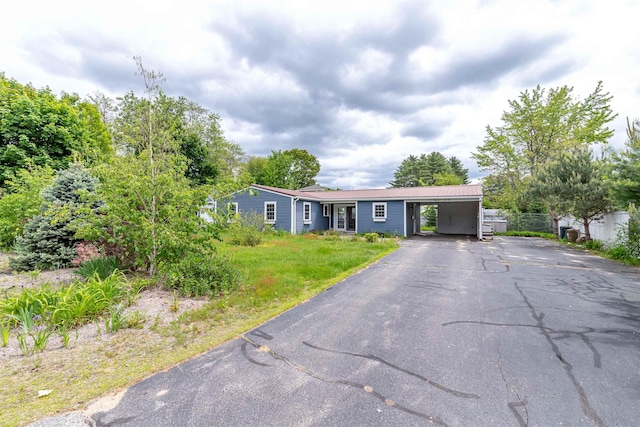 2 Ramsey Dr, Rochester, NH 03839 - ranch-style house with asphalt driveway and a carport