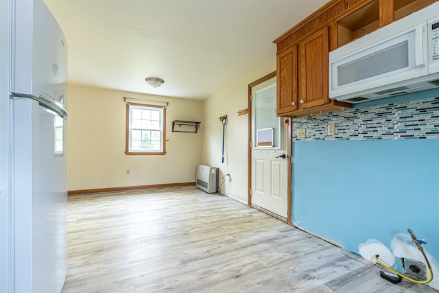 2 Ramsey Dr, Rochester, NH 03839 - laundry area featuring light wood-style floors and baseboards