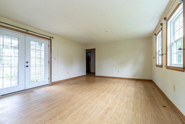 2 Ramsey Dr, Rochester, NH 03839 - empty room featuring light wood-style floors, french doors, and baseboards