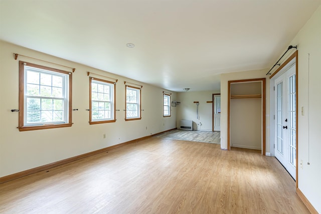 2 Ramsey Dr, Rochester, NH 03839 - unfurnished living room featuring light wood-style floors and baseboards