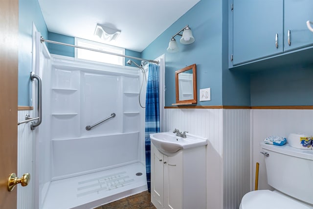 2 Ramsey Dr, Rochester, NH 03839 - bathroom with vanity, a shower with shower curtain, wainscoting, toilet, and stone finish flooring