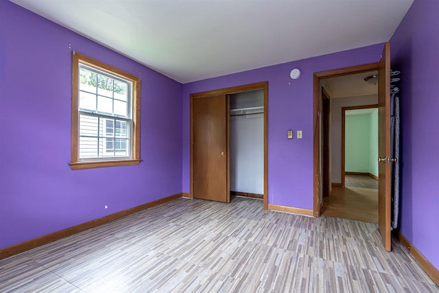 2 Ramsey Dr, Rochester, NH 03839 - unfurnished bedroom featuring light wood-type flooring, baseboards, and a closet