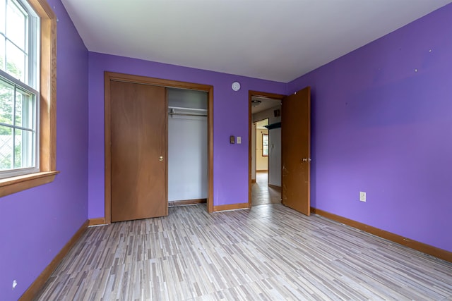 2 Ramsey Dr, Rochester, NH 03839 - unfurnished bedroom featuring light wood-style floors, baseboards, and a closet