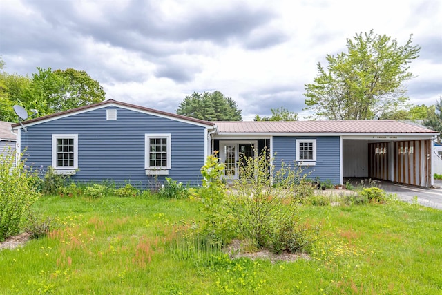 2 Ramsey Dr, Rochester, NH 03839 - view of front of property featuring a carport, driveway, and metal roof