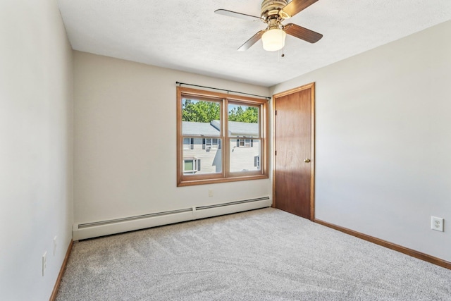 620 Hackett Hill Rd, Manchester, NH 03102 - carpeted spare room featuring a baseboard heating unit, ceiling fan, baseboards, and a textured ceiling