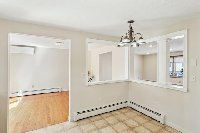 620 Hackett Hill Rd, Manchester, NH 03102 - unfurnished dining area with baseboard heating, an AC wall unit, ornate columns, and a chandelier