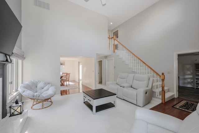 58 Hickory Ln, Windham, NH 03087 - living area featuring a towering ceiling, stairs, ceiling fan, wood finished floors, and recessed lighting